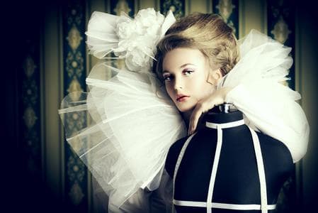 fashion model behind mannequin