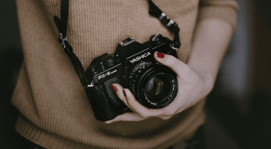 photographer holding camera