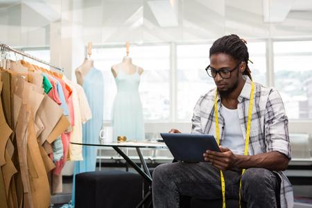 Benefits of Working with a Fashion Recruiter 3 designer on tablet