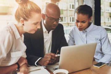 group collaborating on computer