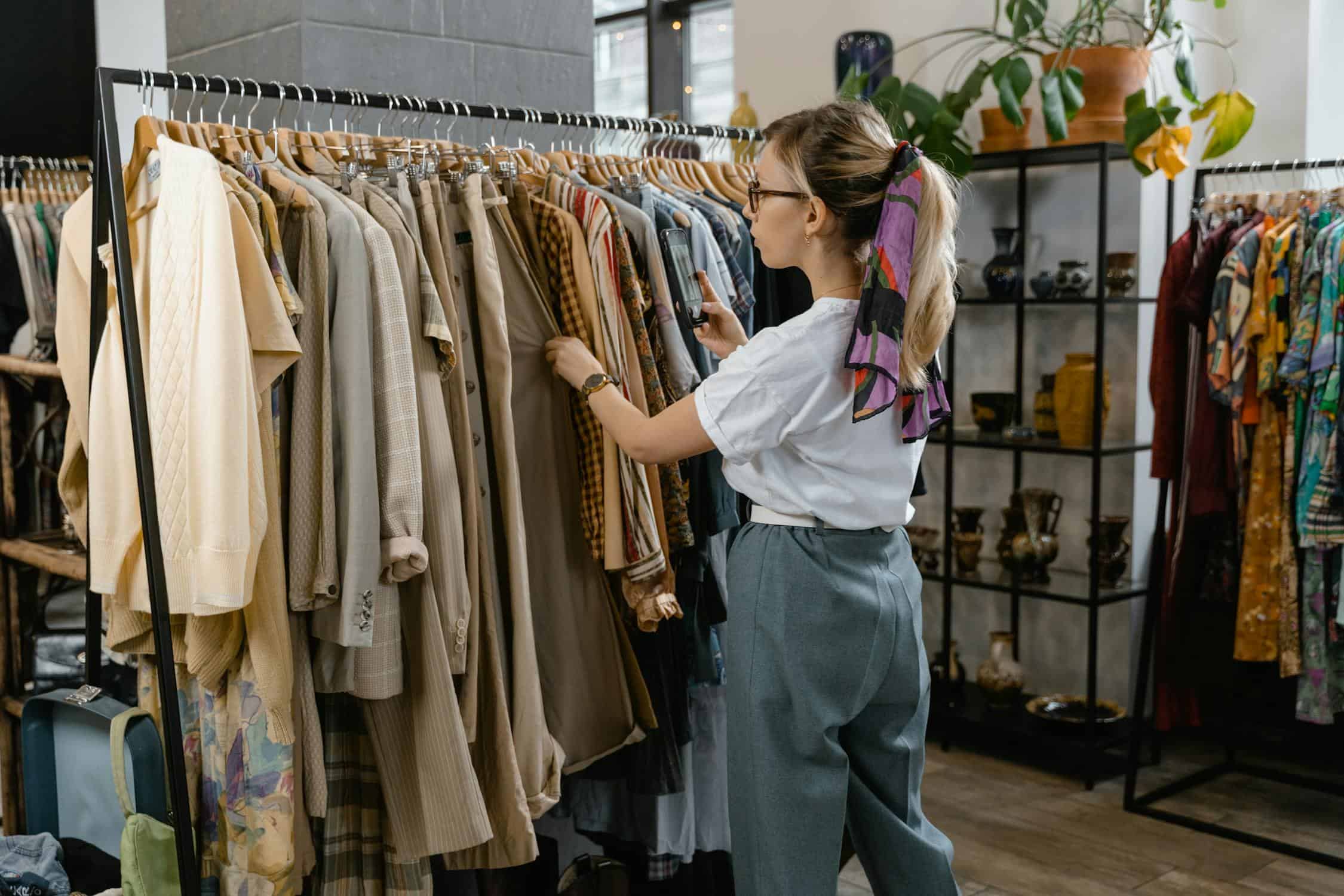 Why Your Fashion Brand's Job Descriptions Are Scaring Away the Best Candidates 1 Fashion professional reviewing a job posting on laptop