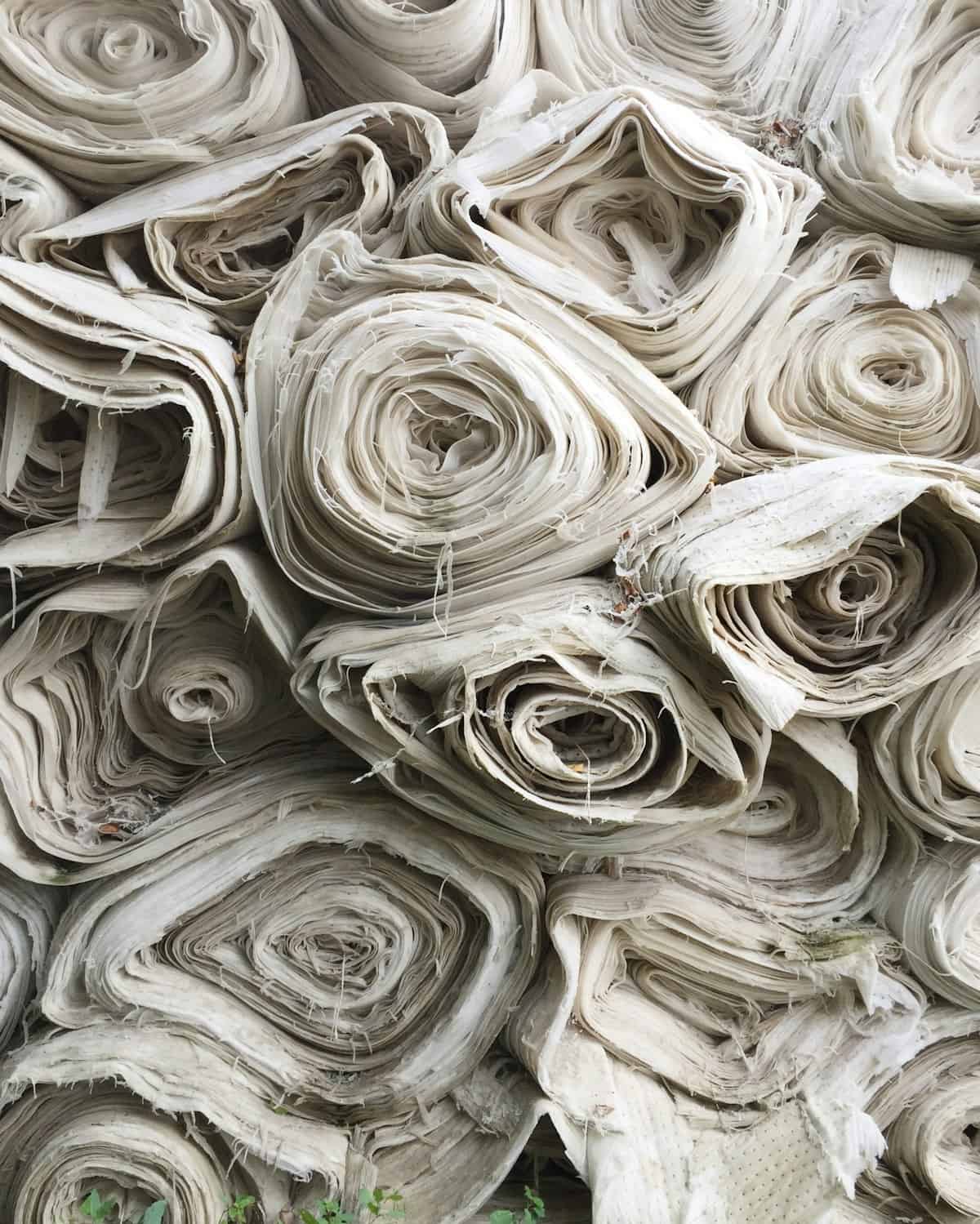 Fashion Buyer Hiring: 5 Key Mistakes 2 fashion buyer hiring textile sourcing with rolls of fabric
