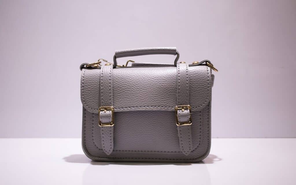 handbag designer hiring and a finished leather handbag